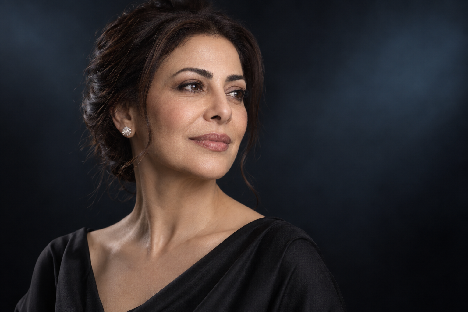 Mature Middle Eastern woman illustrating natural deep plane facelift results