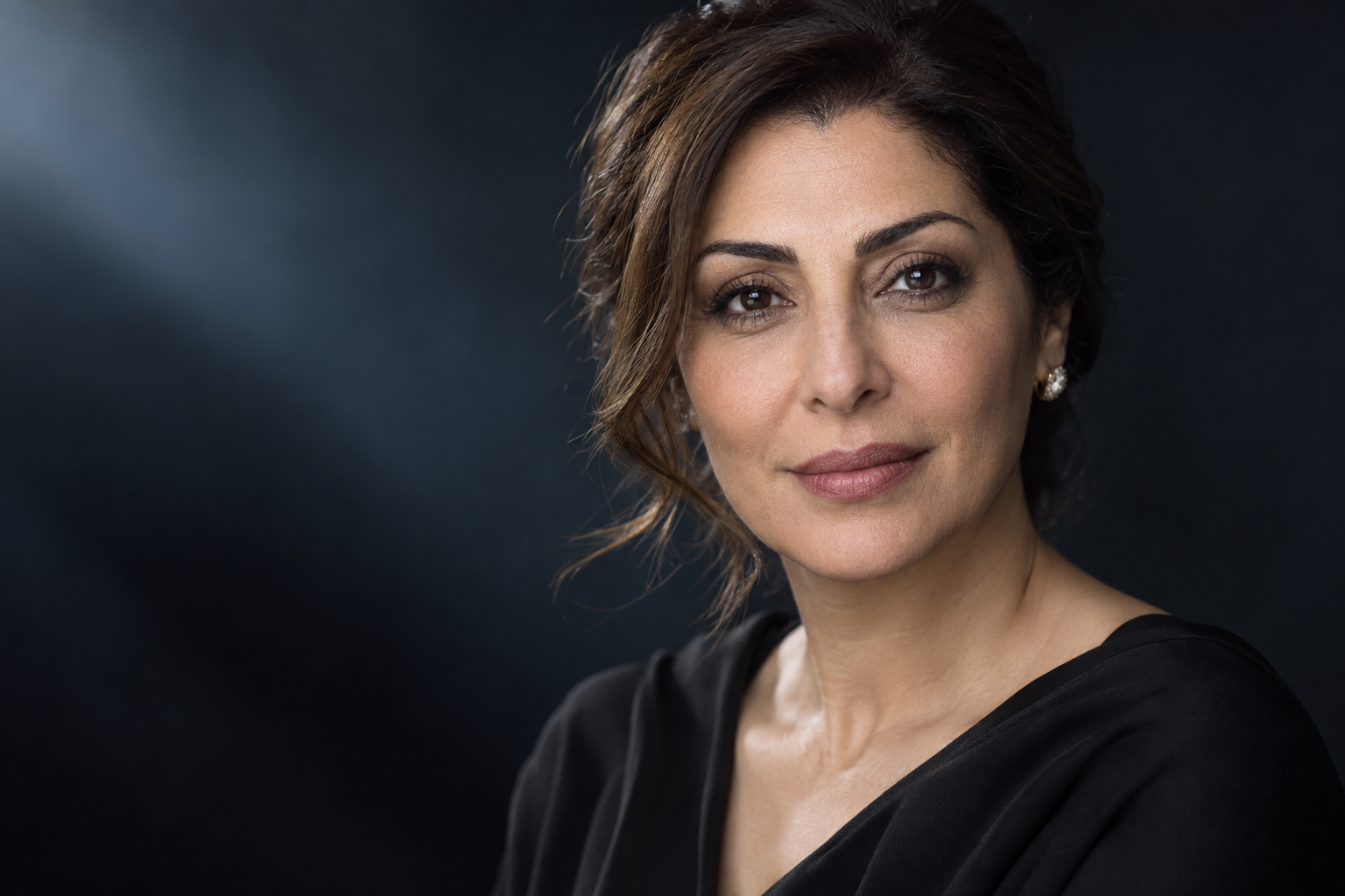 Mature Middle Eastern woman highlighting the eyelid area